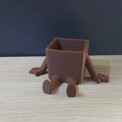 small plant pot with arms and legs