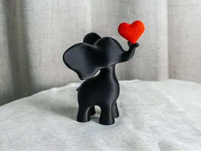 Playful Elephant Heart Sculpture